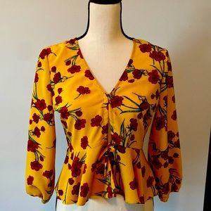 Yellow w/red roses, mid sleeve. Ties & buttons in the front. Flare waist bottom
